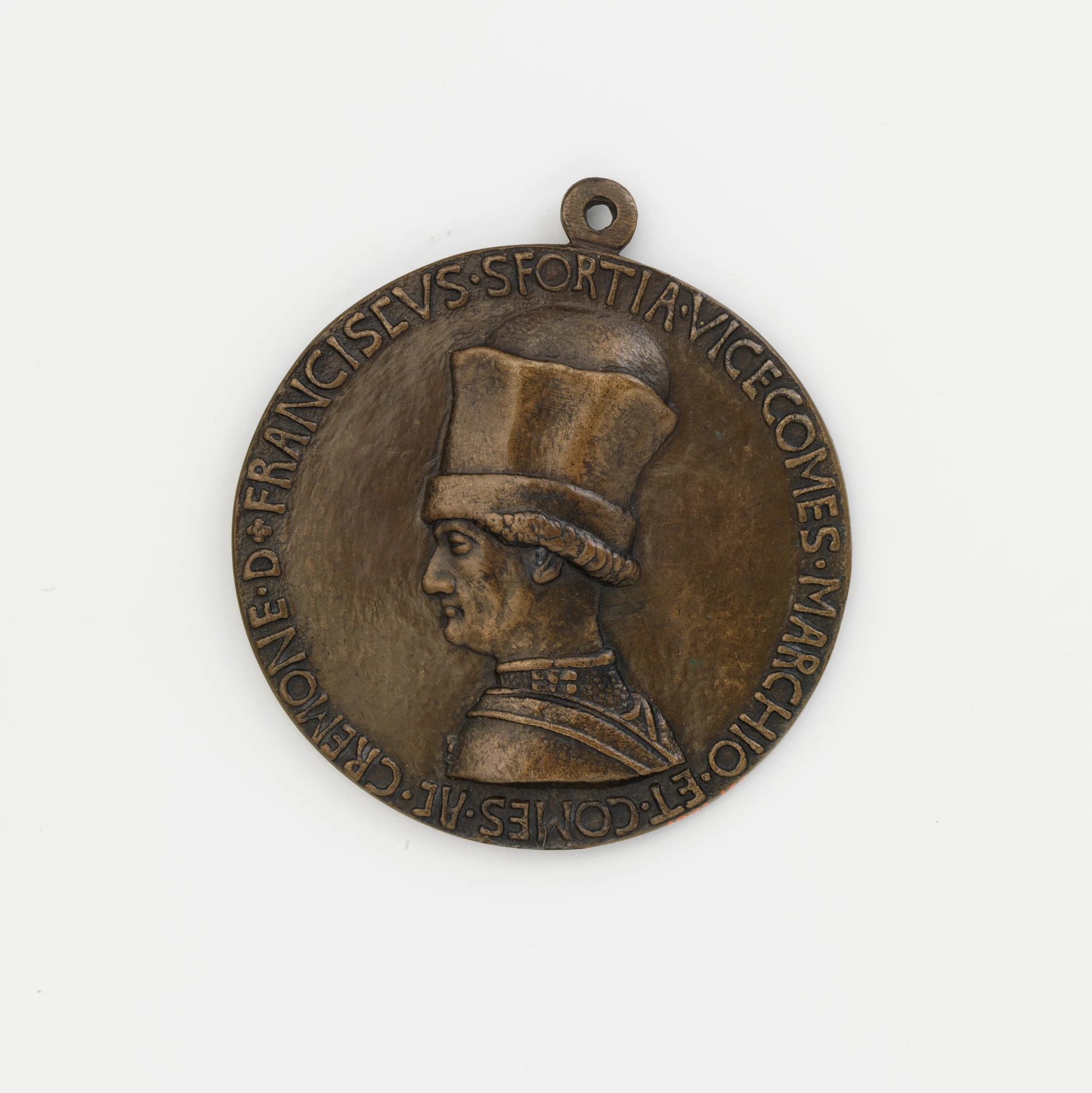 A bronze portrait medal showing Francesco Sforza in profile wearing a tall cap, cast in low relief with a Latin inscription running around the rim and a suspension loop at the top